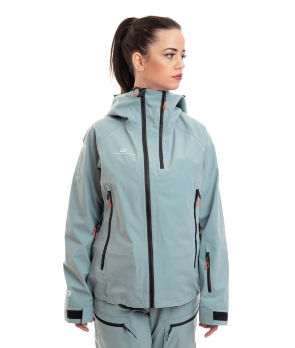 woman wearing dark mint 3 layer ski jacket