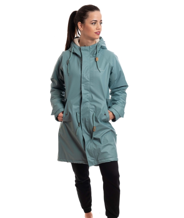 woman wearing dk mint rain coat with pile inside