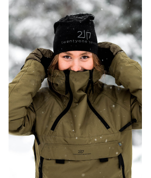 woman in snow wearing 2117 black elastic cap